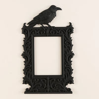 Dark raven-shaped photo frame