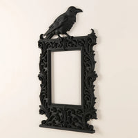 Dark raven-shaped photo frame
