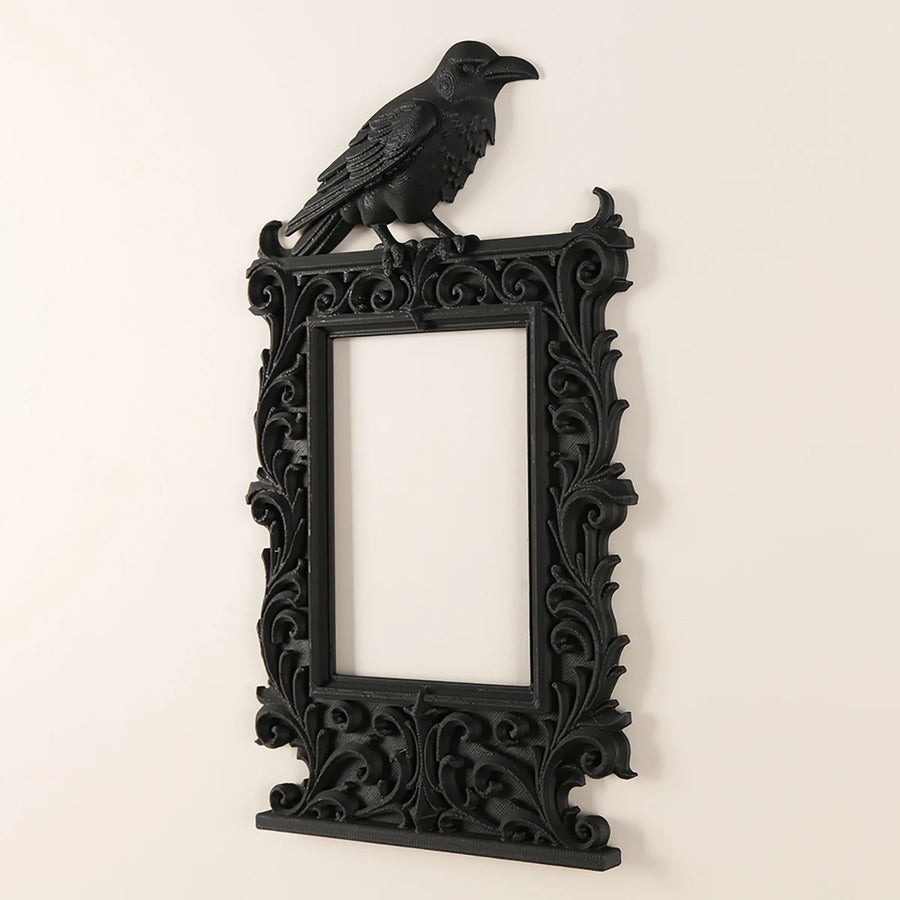 Dark raven-shaped photo frame