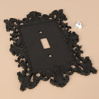 Dark carved switch frame