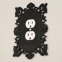 Dark carved switch frame