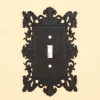Dark carved switch frame