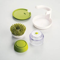 Soap-dispensing dish brush