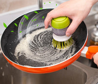 Soap-dispensing dish brush