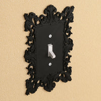 Dark carved switch frame