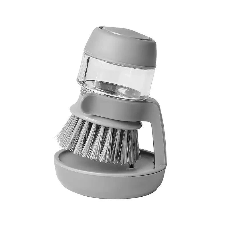 Soap-dispensing dish brush
