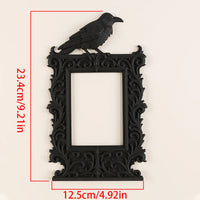 Dark raven-shaped photo frame