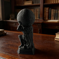 Dark Atlas skeleton sculpture