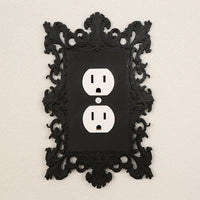 Dark carved switch frame